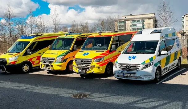 Four ambulances lined up ready for delivery to Ukraine