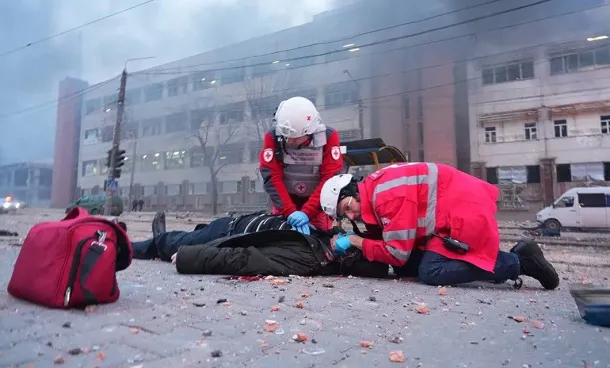 Medics treat a wounded person during an emergency response in Ukraine.